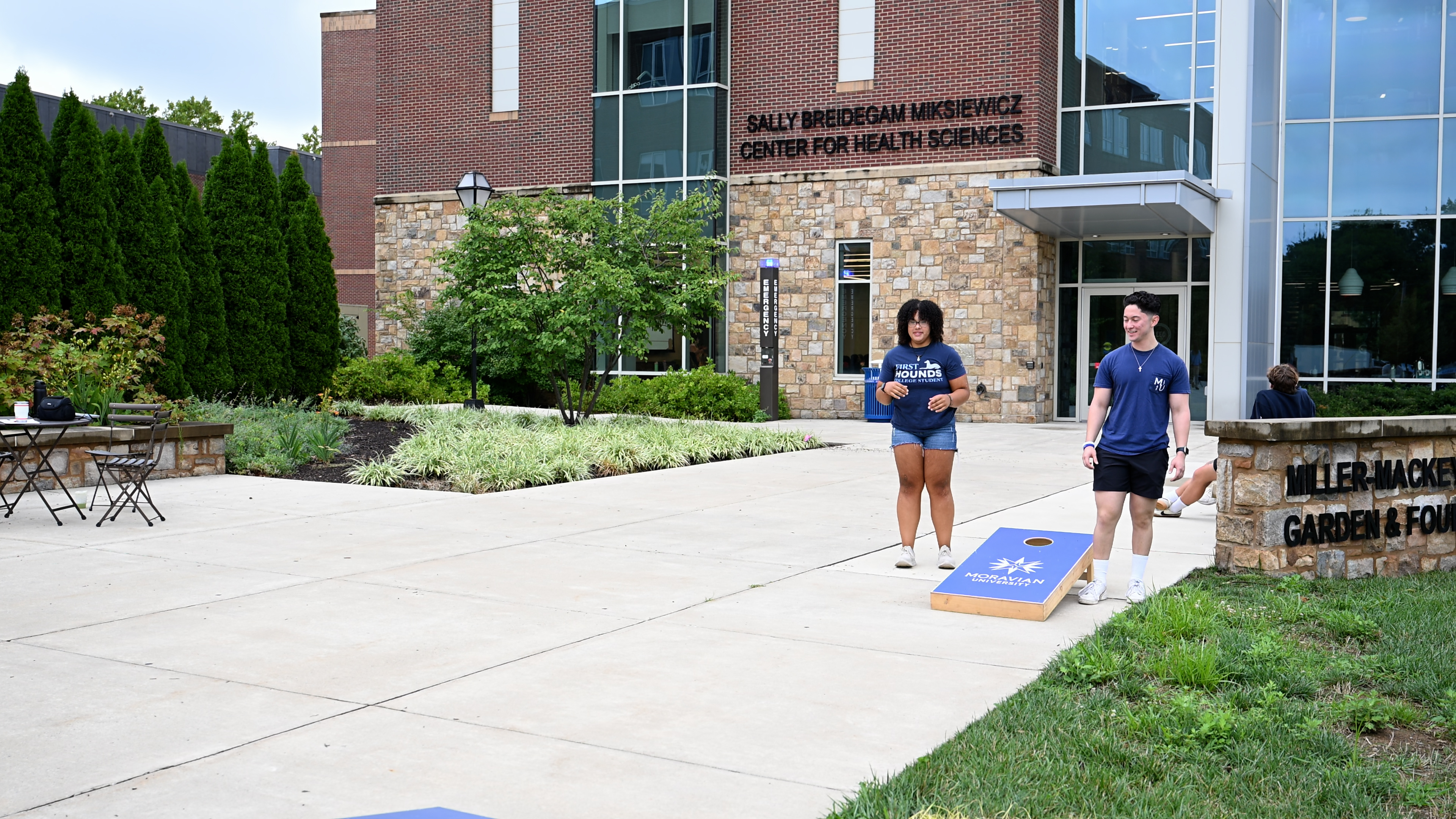 Student playing cornhole