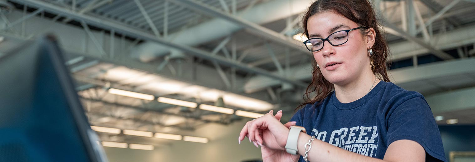 Student using Apple Watch