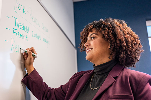 Student at white board